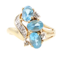 Estate 1.35 ctw Oval Blue Topaz and 0.07 ctw Diamond 10KT Yellow Gold Ring 3.4g