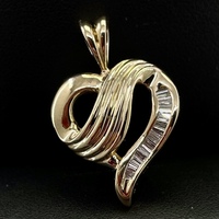 Gold Heart Shaped Pendant With Diamond Baguettes 14kt