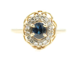 Women's 0.30 Ct Oval Cut Sapphire & Round Diamond Halo 14KT Yellow Gold Ring