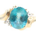 Women's 2.35 Ct Oval Blue Topaz & Diamond Accents 10KT Yellow Gold Bypass Ring