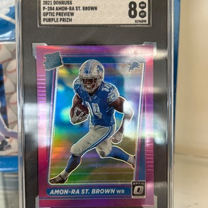 Amon-Ra ST Brown DONRUSS PURPLE PRIZM SGC 8