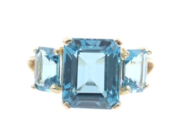 Women's 3-Stone 7.60 Ctw Emerald Cut Blue Topaz 10KT Yellow Gold Ring - 4.5g